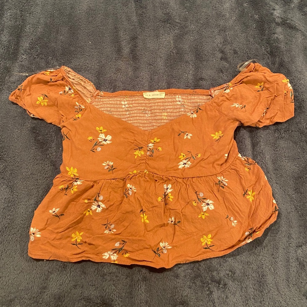 Pink flowy top with flowers on it